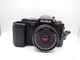 Black Konica FS-1 Film Camera with 3 lenses 40mm, 28mm, and 135mm lenses