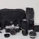 Canon AV-1 35 mm Camera With FD 50 mm 1:1.8 Lens Untested With Extra Lenses