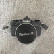 Olympus OM-1 35mm SLR film camera with Bushnell 28mm f/2.8 lens