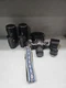 CANON AE-1 PROGRAM 35mm MANUAL SLR FILM CAMERA W/ TWO LENSES & EXTRAS UNTESTED