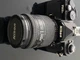 Nikon FM3 A camera 35 mm with Nikon 28 - 105 mm lens and black body.