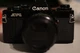 canon av-1 camera with canon camera bag camera strap and camera battery