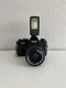 Vintage Vivitar V335 35mm SLR film camera with a Vivitar 102 Detachable Flash