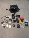 Minolta XG-1 Film Camera W/ Lenses, Flash, Filters, Manuals, & More Untested