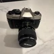 Nikon FM10 SLR Camera Silver Black with Nikon Lens & Tiffen 52mm UV Protector