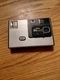 Silver Kodak Disc 4000 Camera by Eastman Kodak Company with strap - Untested