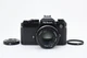 Nikon FE 35mm SLR Film Camera Black w/ Ai-s NIKKOR 50mm f/1.8 Lens