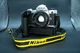 Nikon FM 35mm film camera with 50mm f/1.8 lens and MD-12 motor drive.