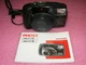 PENTAX ZOOM 105R 35MM CAMERA WITH MANUAL STRAP AND NEW BATTERIES WORKS