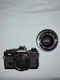 Olympus OM-4 Black SLR Film Camera with Zuiko Lens and Tripod