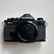 Olympus OM-2S Program 35mm Black Film Camera with Body Cap. Needs Repair