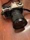 Nikon FM10 35mm SLR Film Camera with 28-70 mm PROMASTER SPECTRUM lens Kit