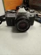 Canon AE-1 35mm SLR Film Camera with Canon 50mm f/1.8 FD Lens - WORKS