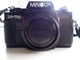 Minolta X-7A SLR Film Camera w/two lenses, strap, manual, and flash unit