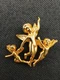 1990s gold tone 3D trio of playful cherubs/angels brooch