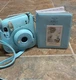 Fujifilm Instax Mini 11 Instant Camera Sky Blue with Case and photo album.