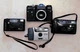 4 film cameras: ZENIT EM, Konica AF-800, Pentax PC-550, Polaroid 35mm 