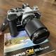 Olympus OM-2 Silver 35mm Camera With Zuiko Auto Zoom 35-105mm Lense