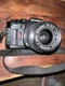 Olympus OM40 35mm Film Camera w/ Zuiko 35-70mm f/3.5-4.5 Lens & Strap Working