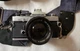 Olympus OM-2 SLR Film Camera with 50 mm lens carrying case and additional lenses