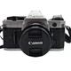 Canon AE-1 Program 35mm SLR Film Camera with 50mm Lens New Battery Located U.S.A