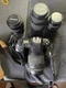 vintage Nikon N6006 35mm SLR film camera equipped with a Tamrac strap and severa