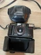 Vintage Yashica MF 2 DX 35mm film camera with 38mm f/3.8 lens and carrying case.